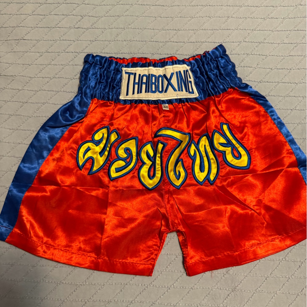🥊 Muay Thai Boxing Shorts – Red & Blue Satin with Thai Script